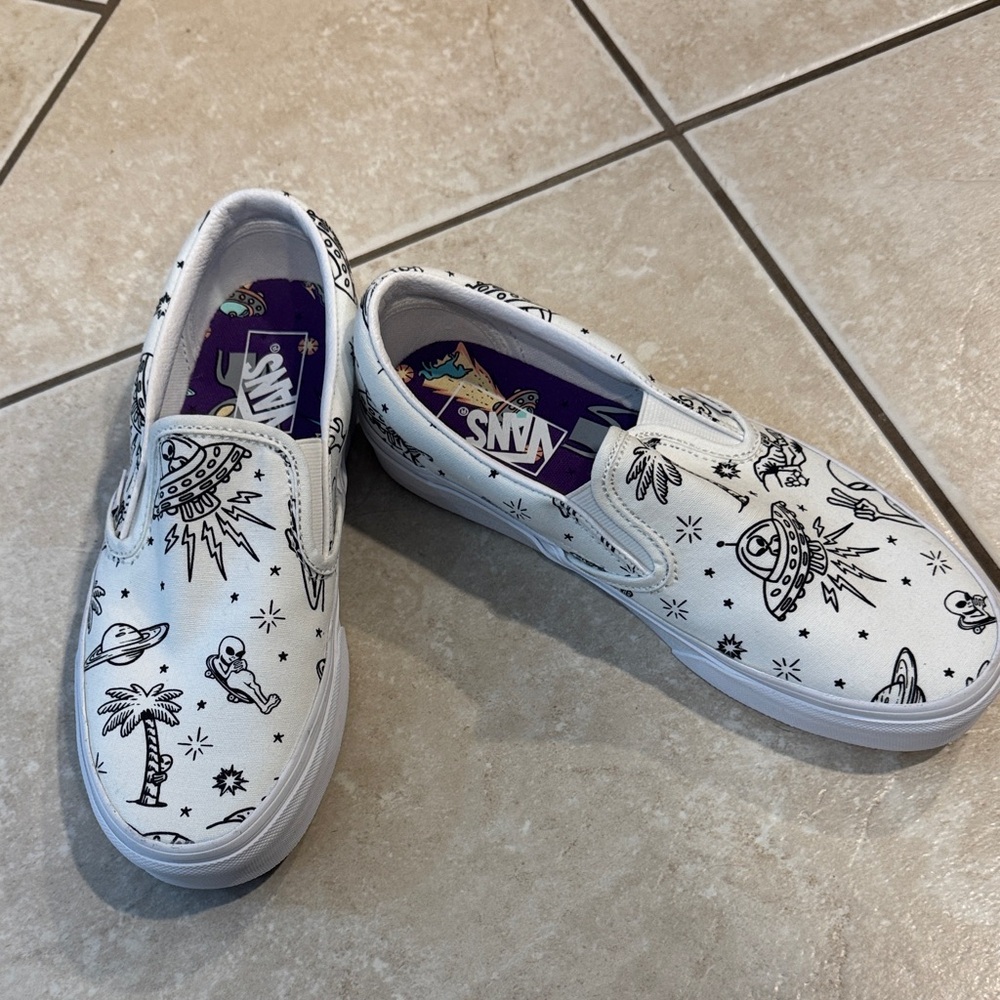 Vans White Slip-On Sneakers with Black Space Themes Graphics
